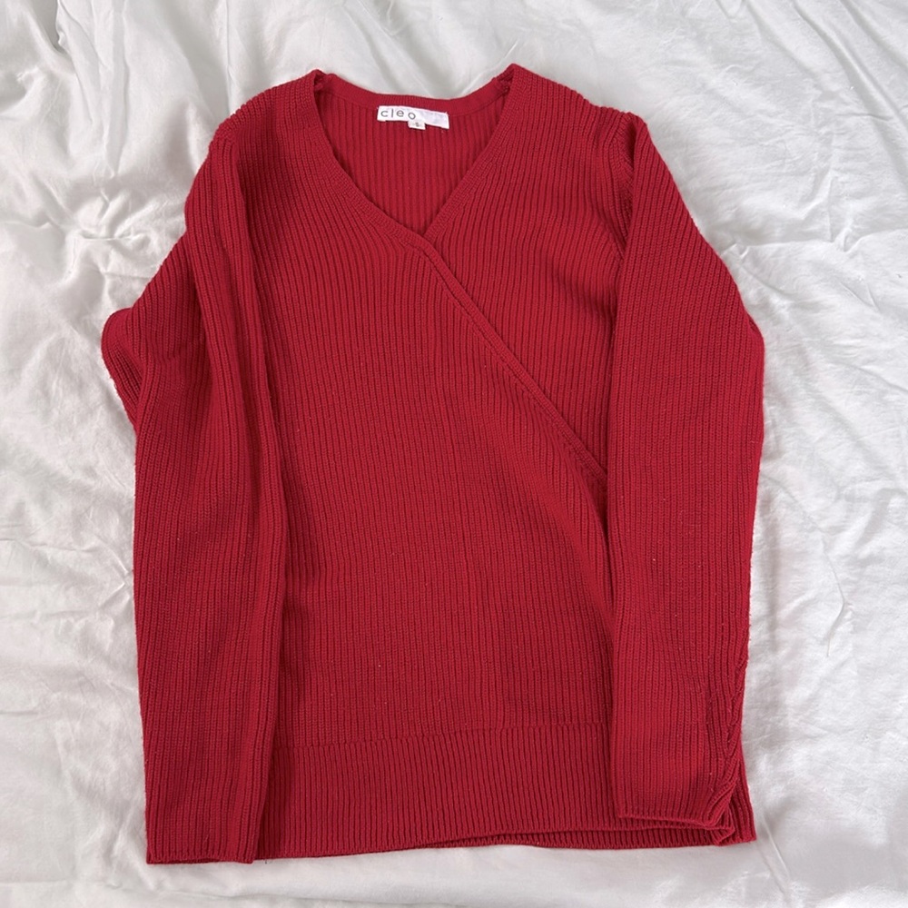Cleo knit sweater with faux wrap detail.